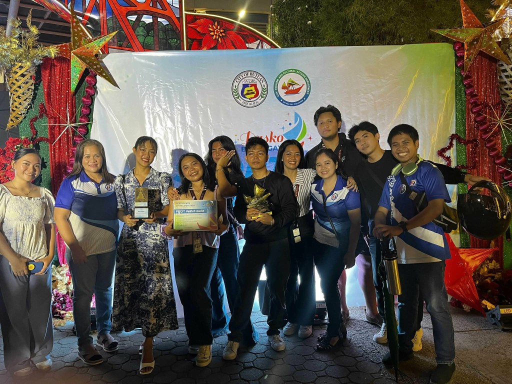Mane Talibong with The Watch Guild team at PECIT, holding awards at a recognition event in Butuan City